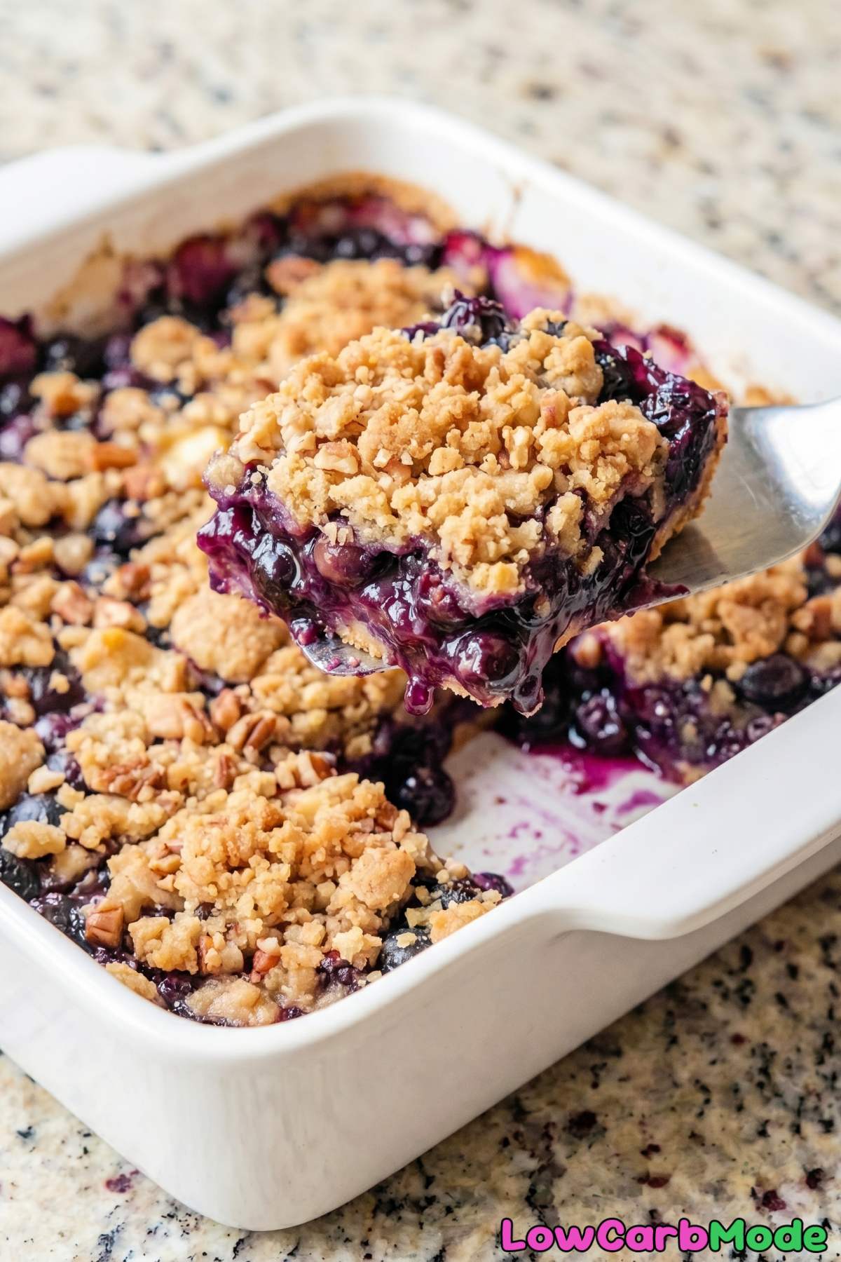 Buttery keto blueberry crumble on a plate