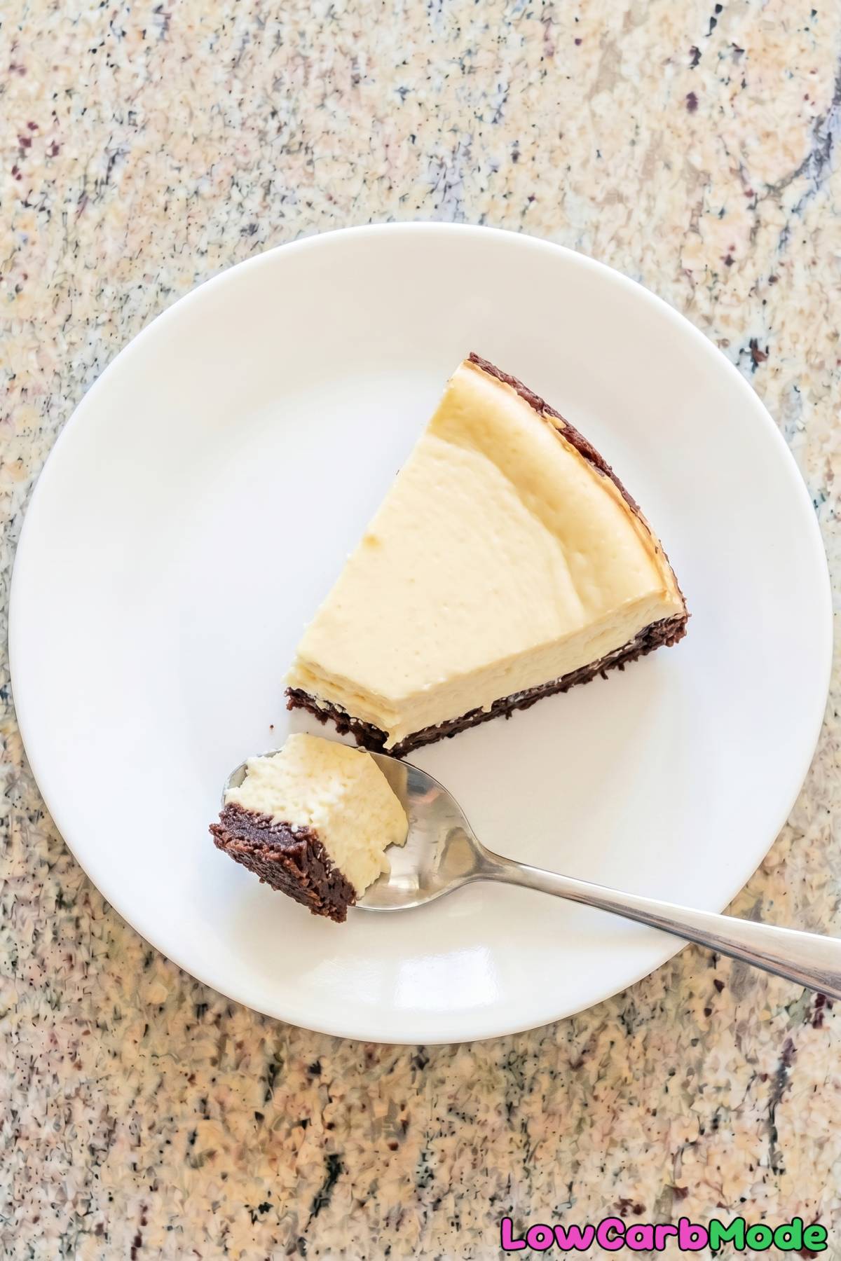 Creamy keto brownie bottom cheesecake slice
