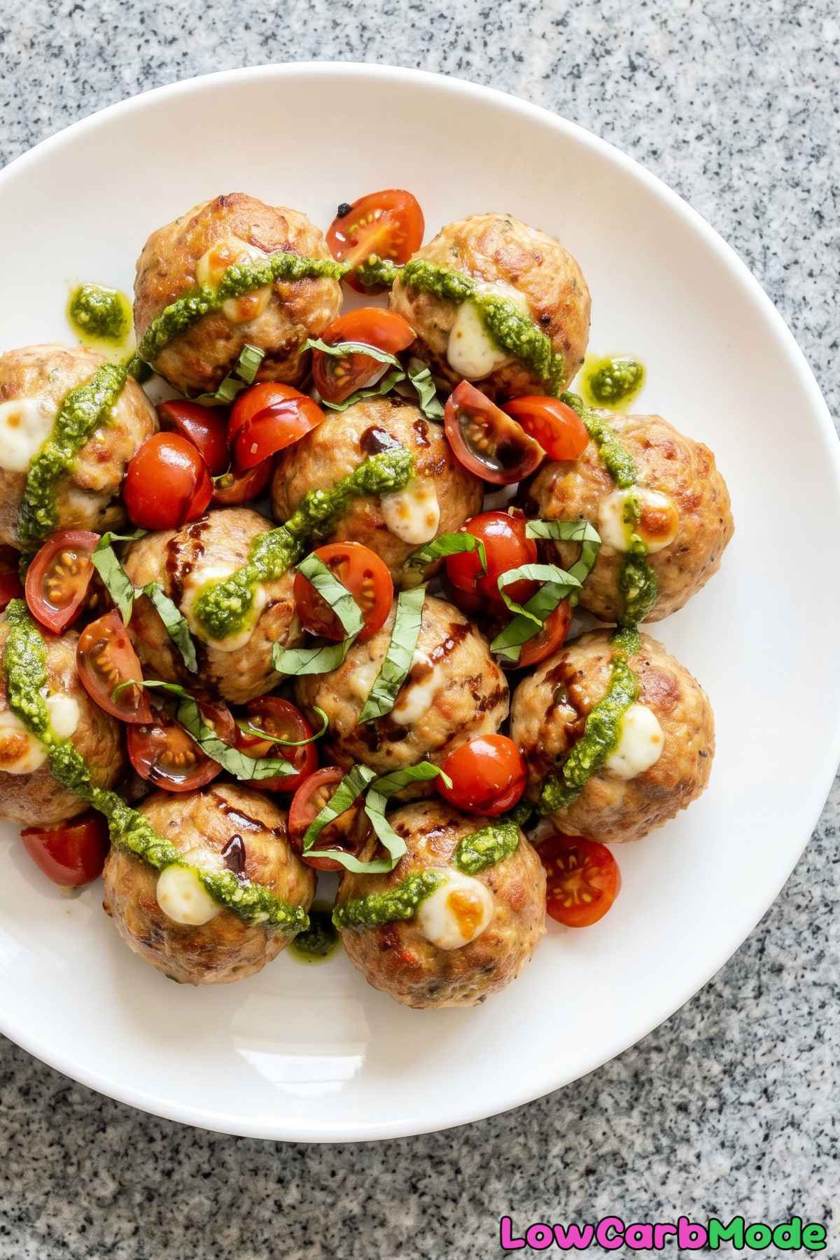 tender caprese stuffed meatballs on a plate