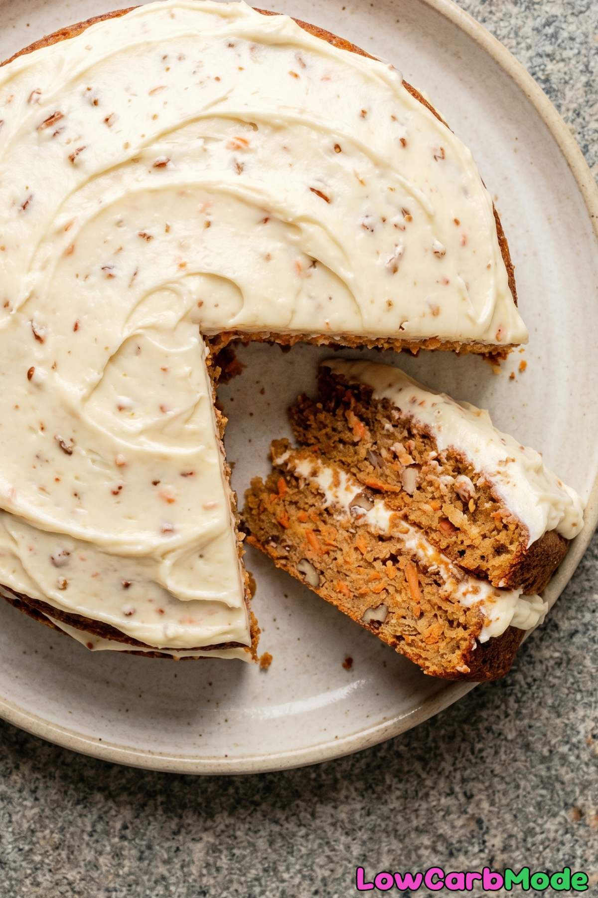 Rich keto carrot cake topped with walnuts