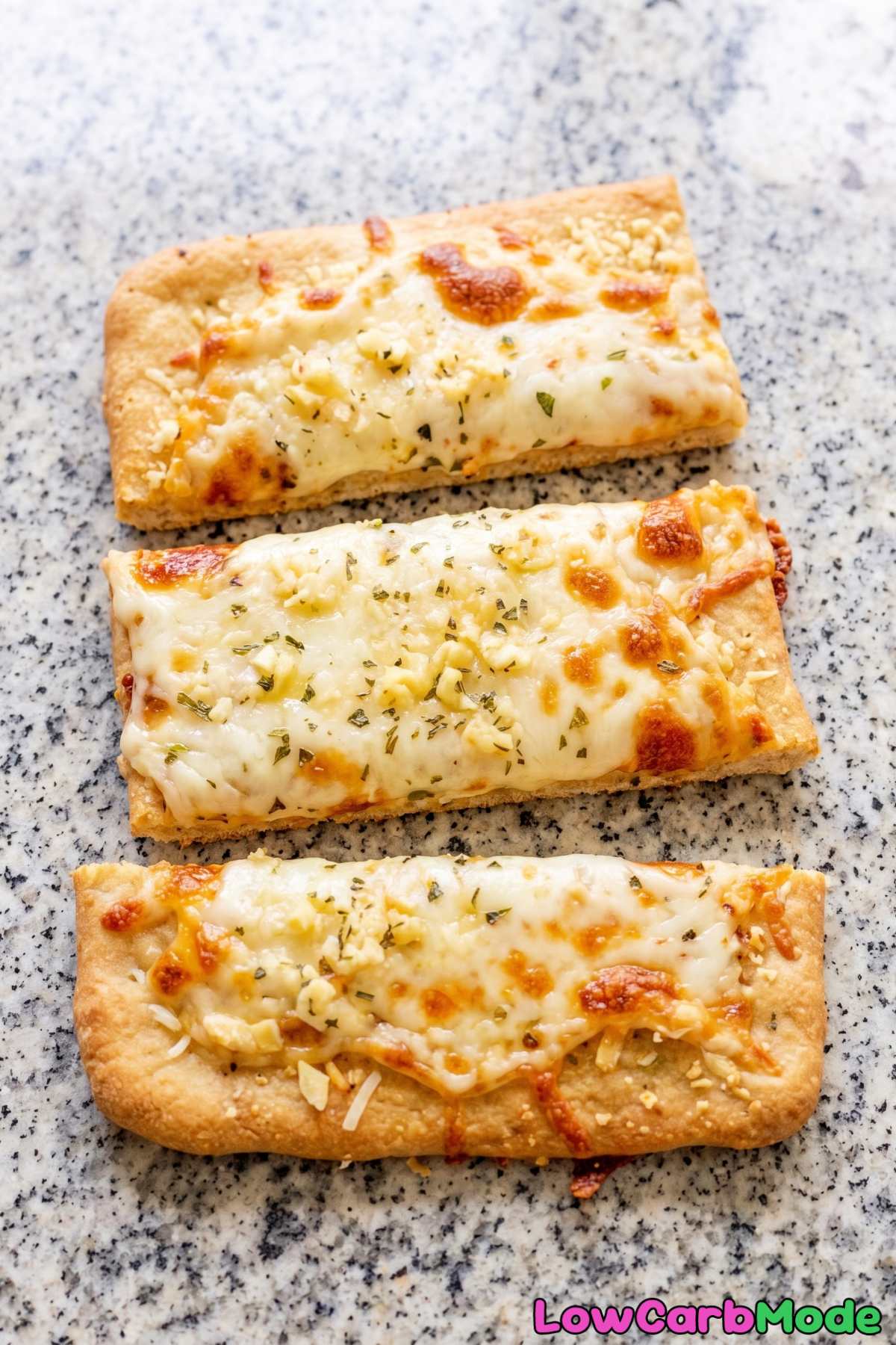 Toasty keto cheesy breadsticks with butter