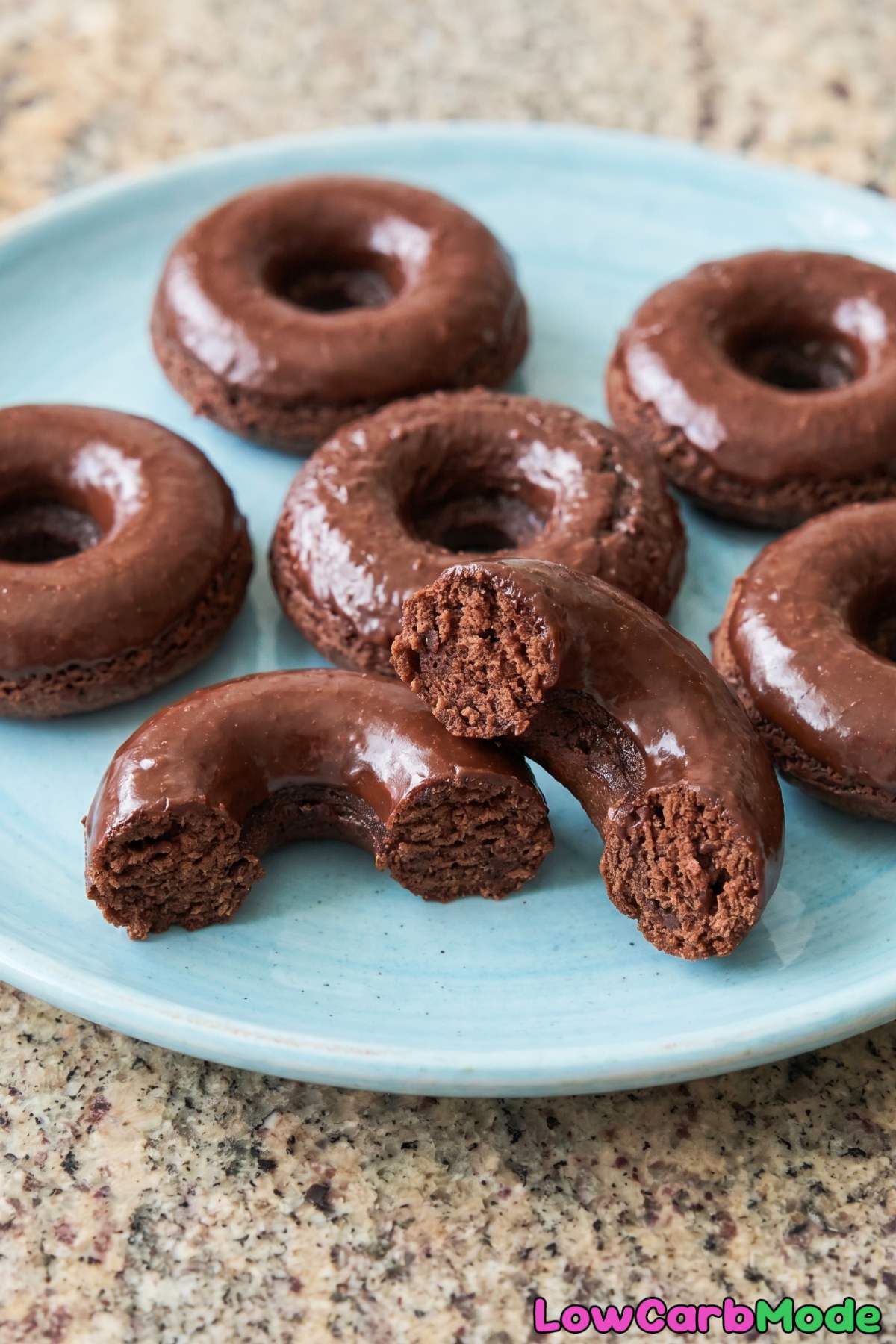 Soft keto chocolate donuts on a rack