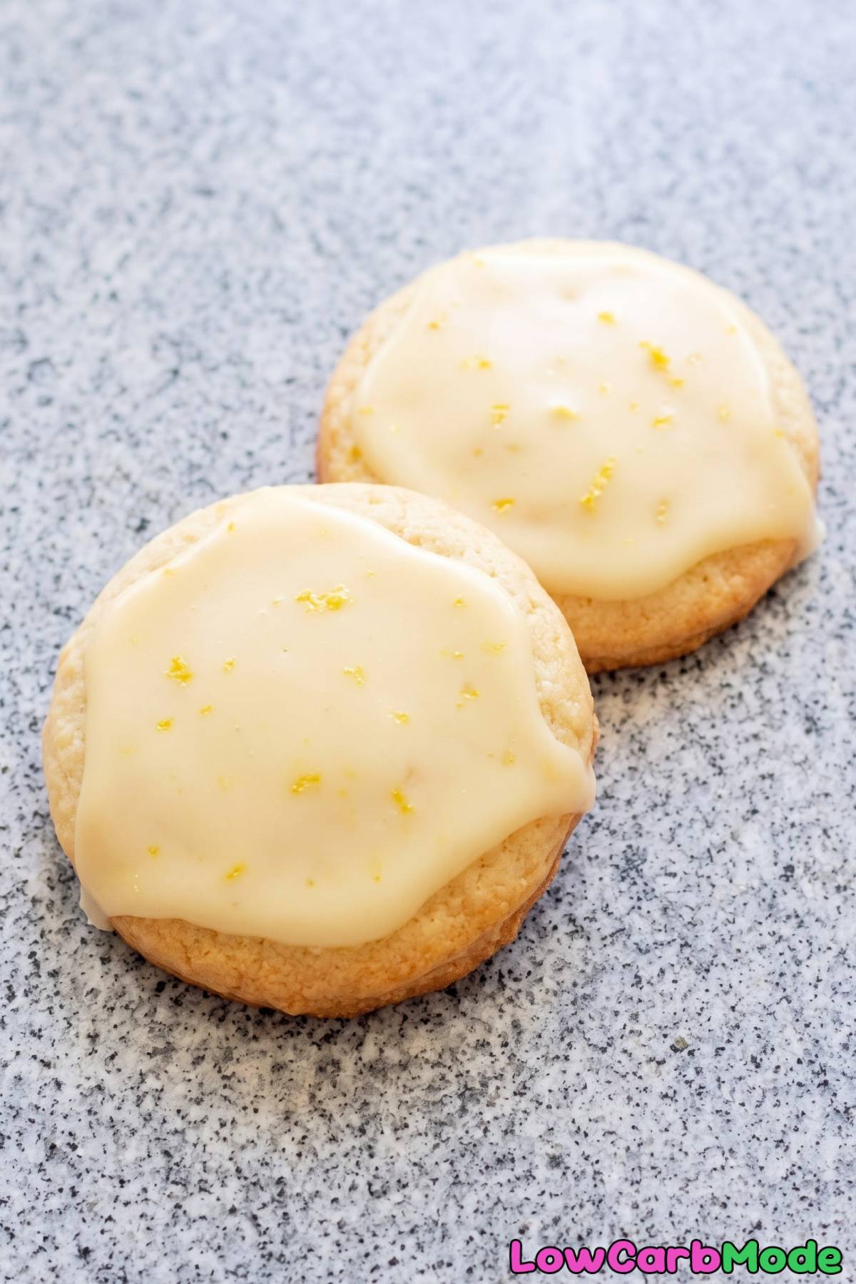 Soft keto glazed lemon cookies on a plate