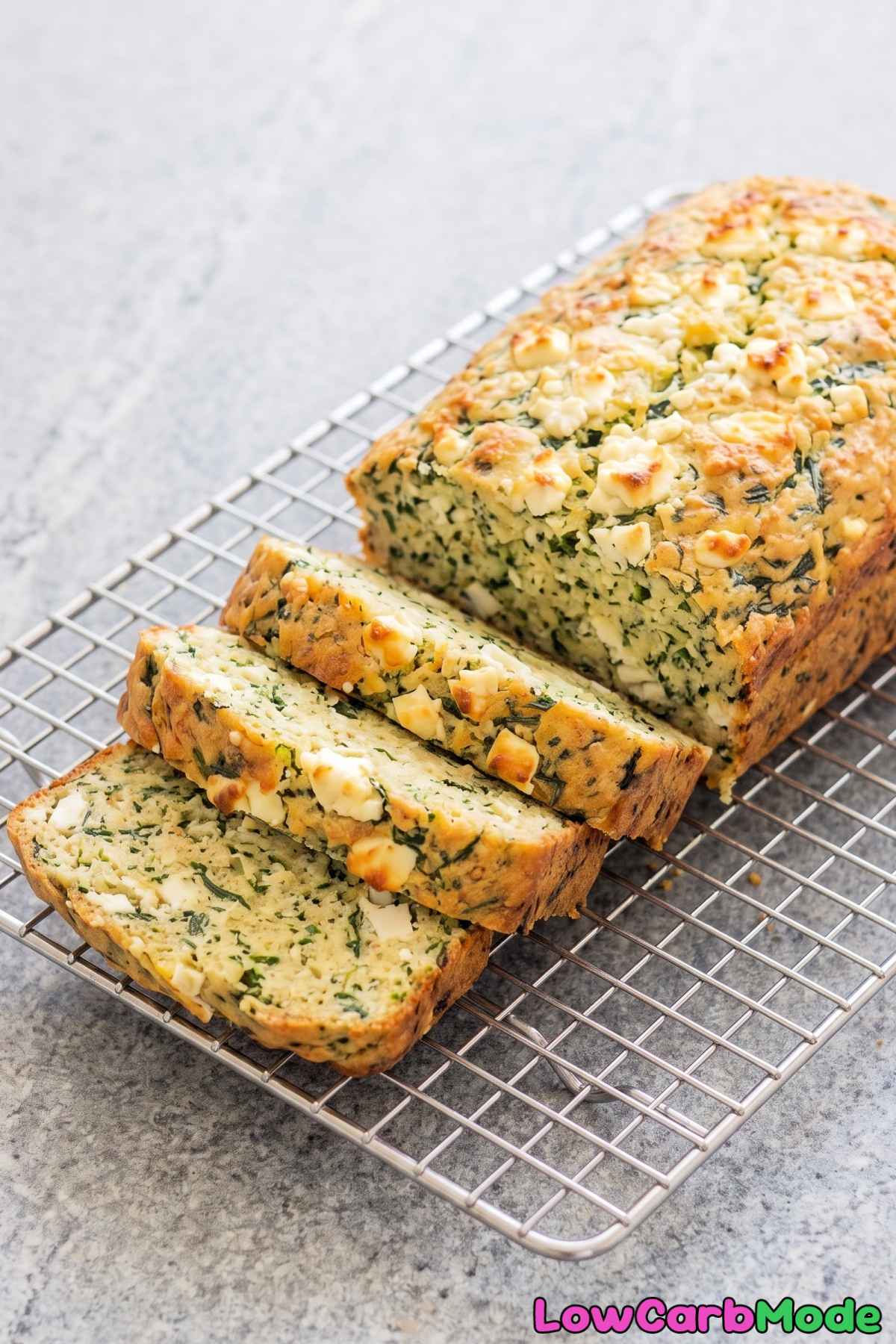 Slice of warm spinach feta cottage cheese loaf