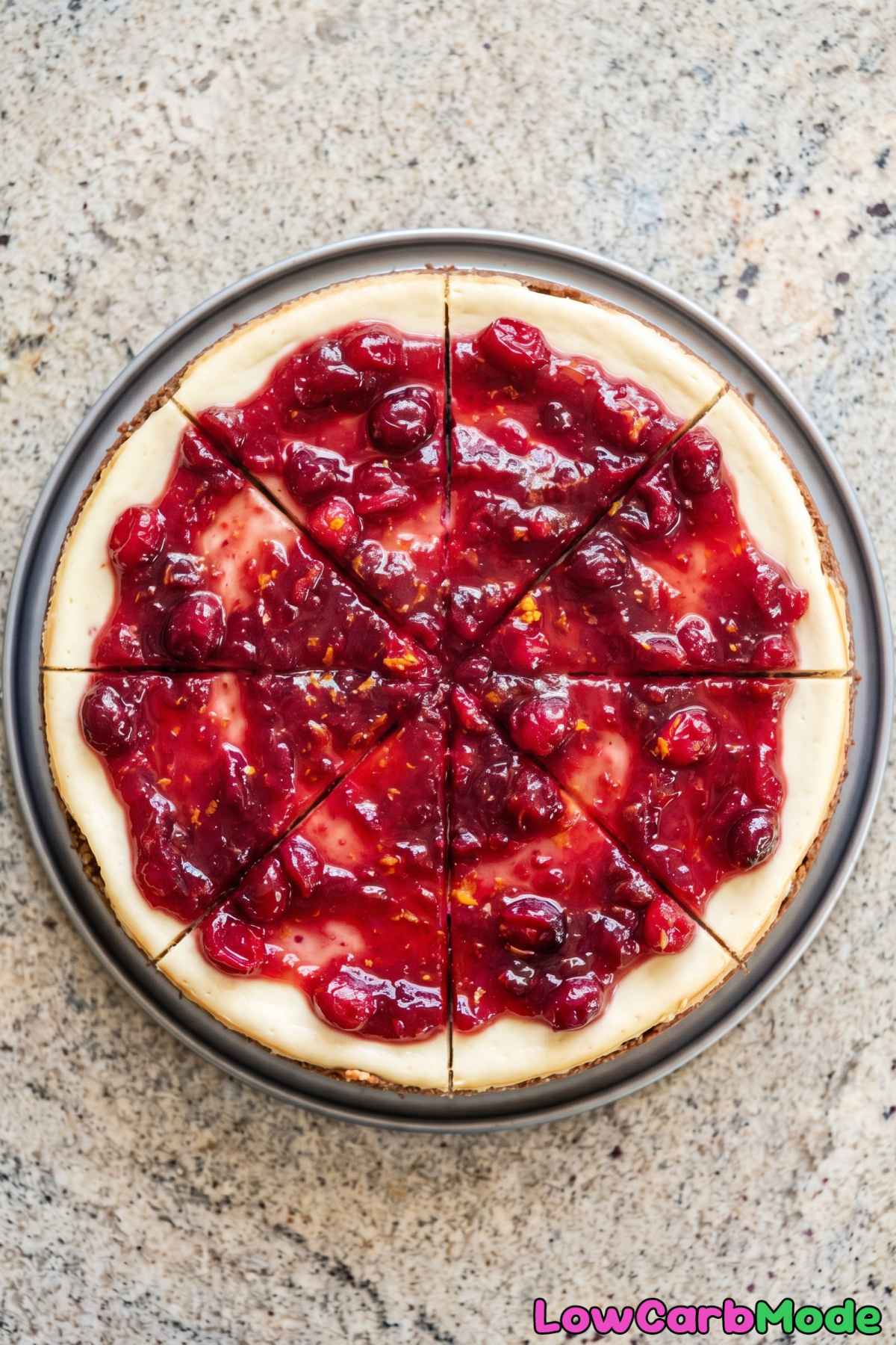 Keto cheesecake topped with cranberries