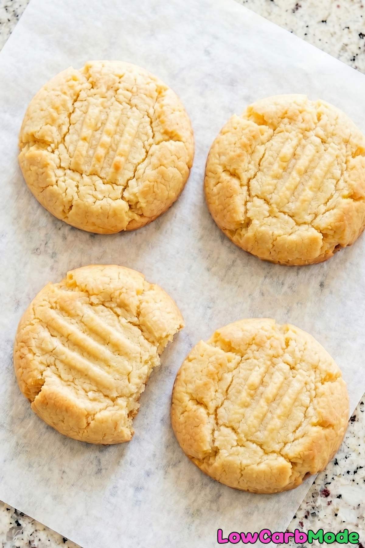 Golden keto cream cheese cookies on a rack