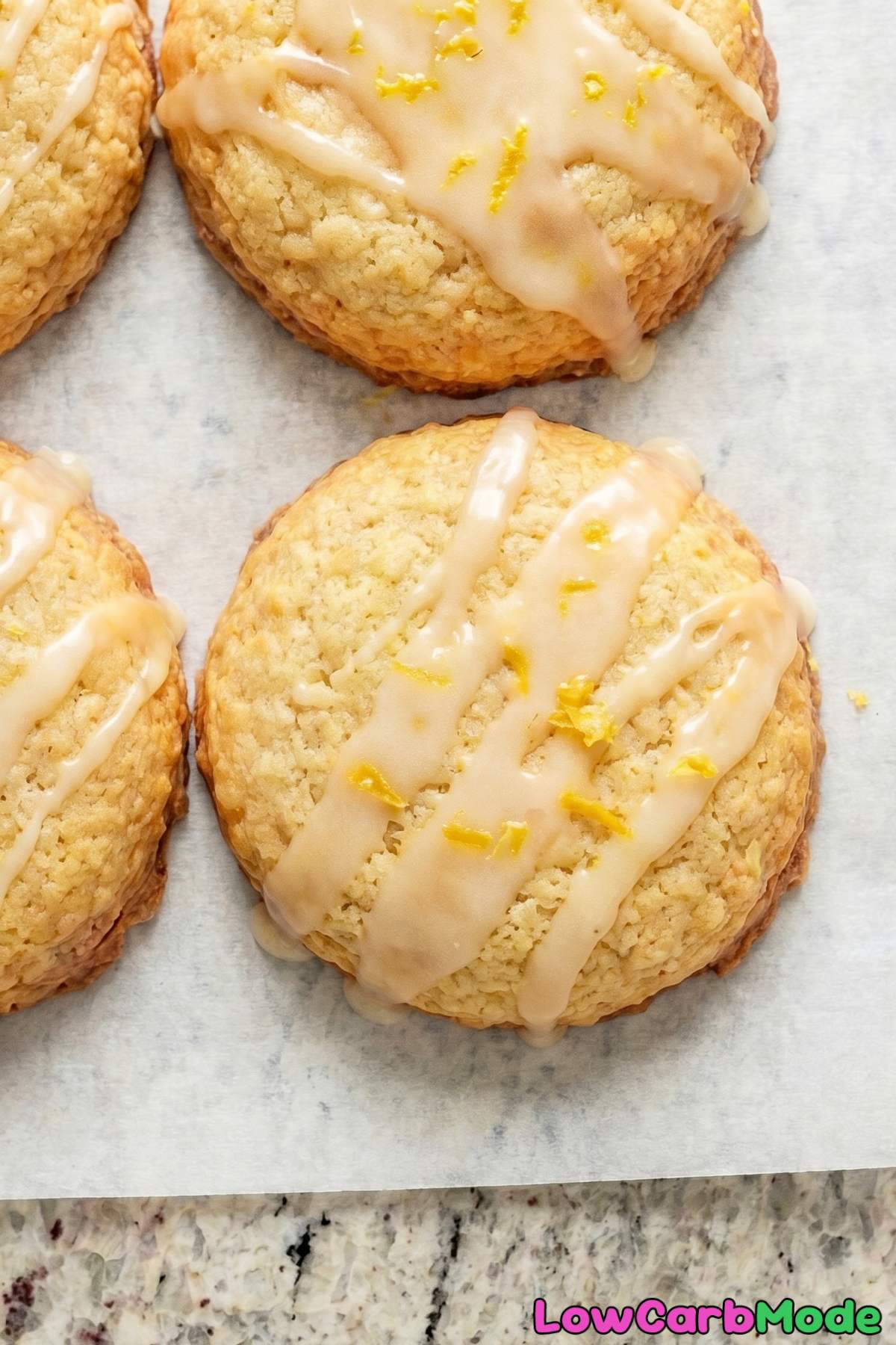 Soft keto lemon cookies stacked up
