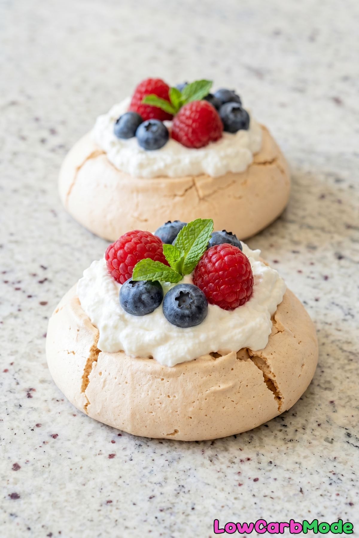Airy keto mini pavlovas with juicy berries