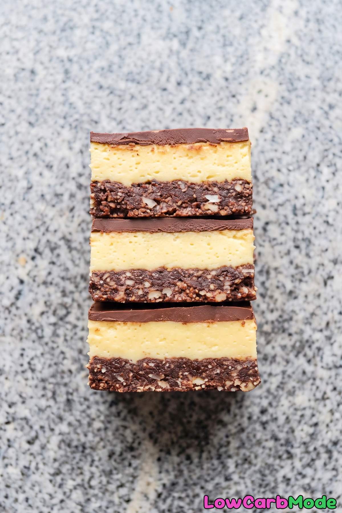 layered keto nanaimo bar with chocolate