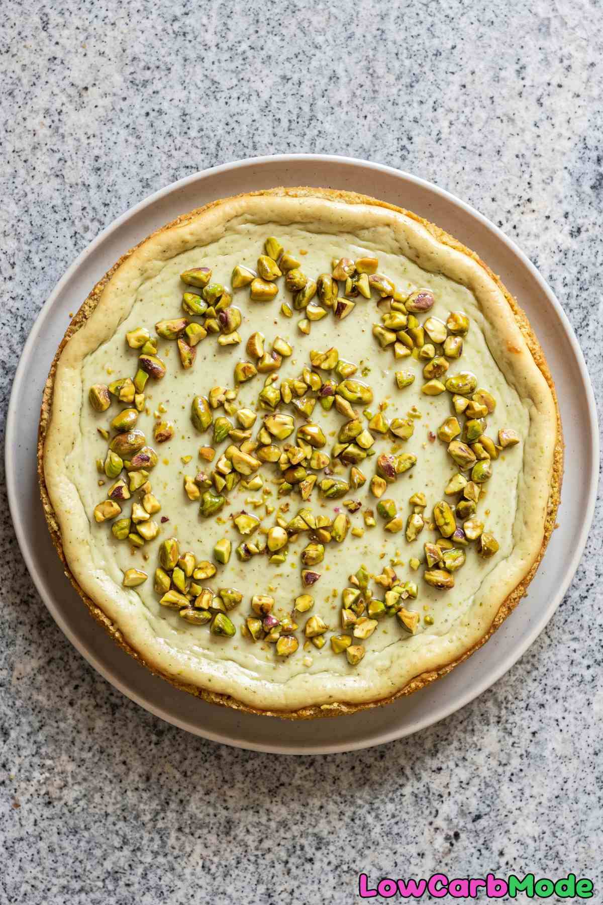 Sliced pistachio rose cheesecake