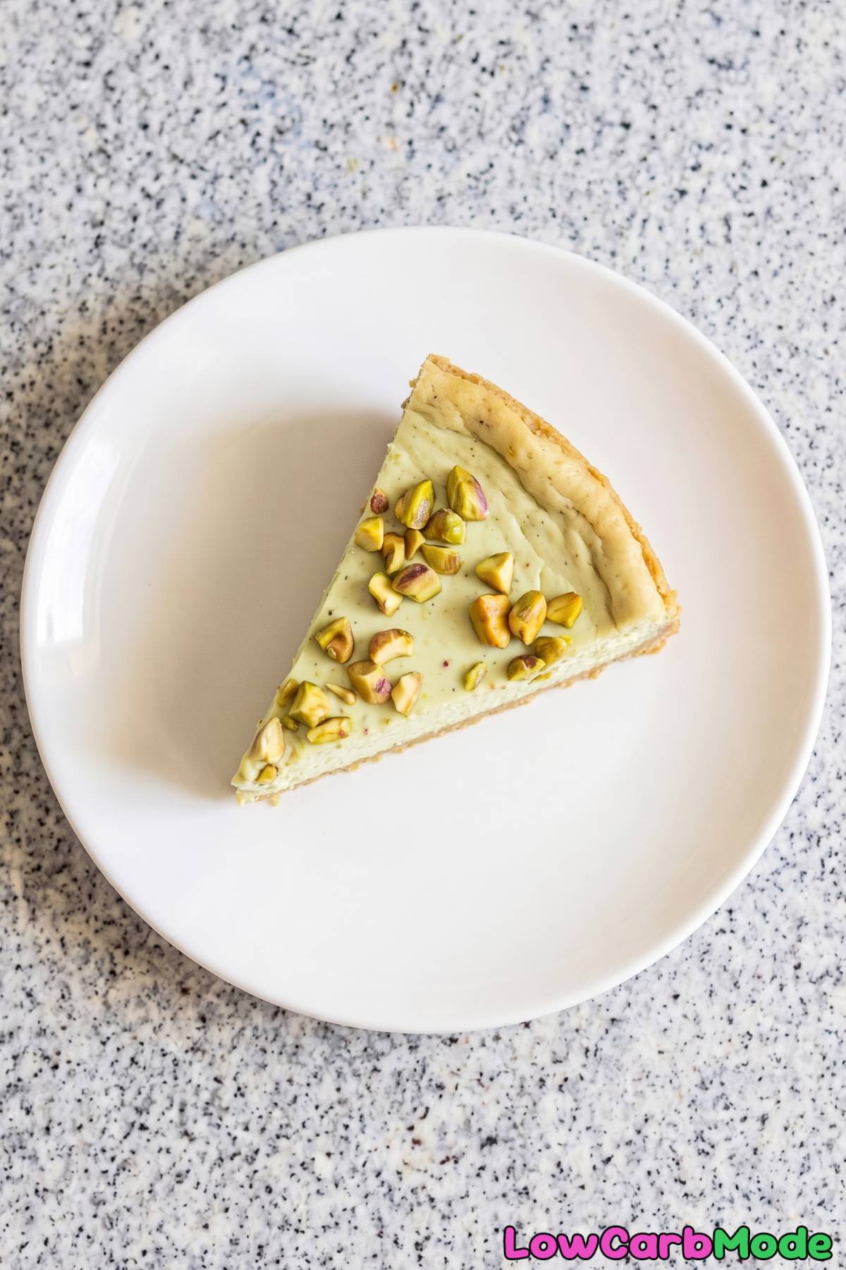 Rich pistachio rose cheesecake slice
