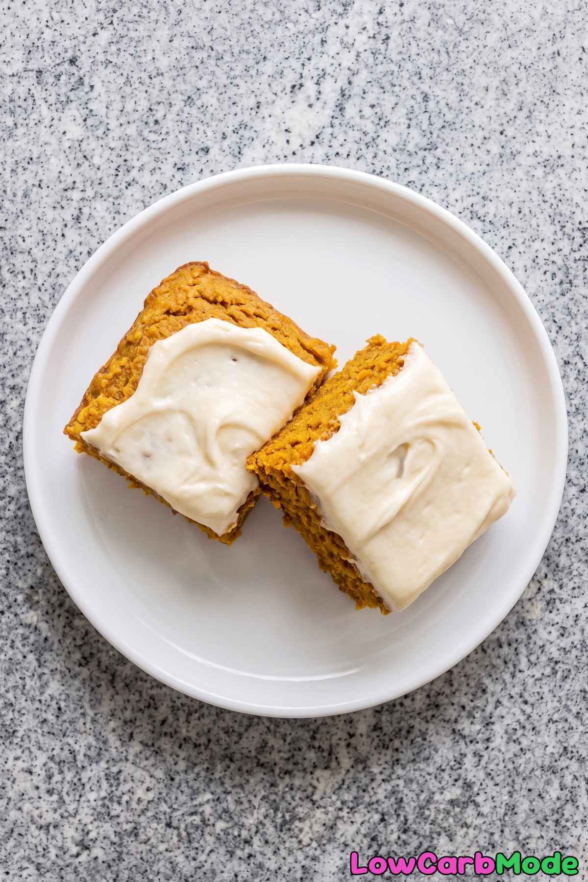 A plate of frosted keto pumpkin bars