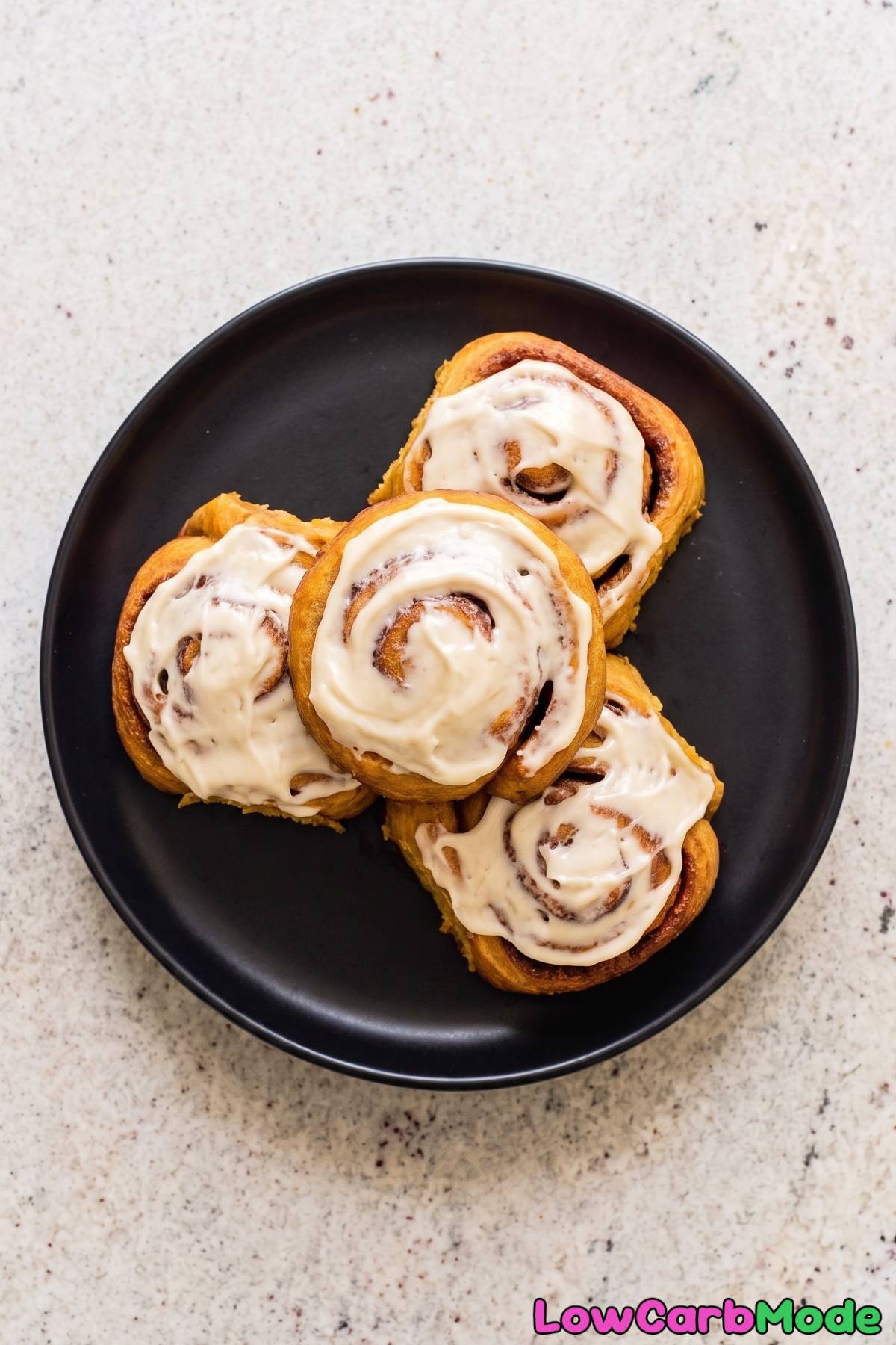frosted keto pumpkin spice cinnamon rolls