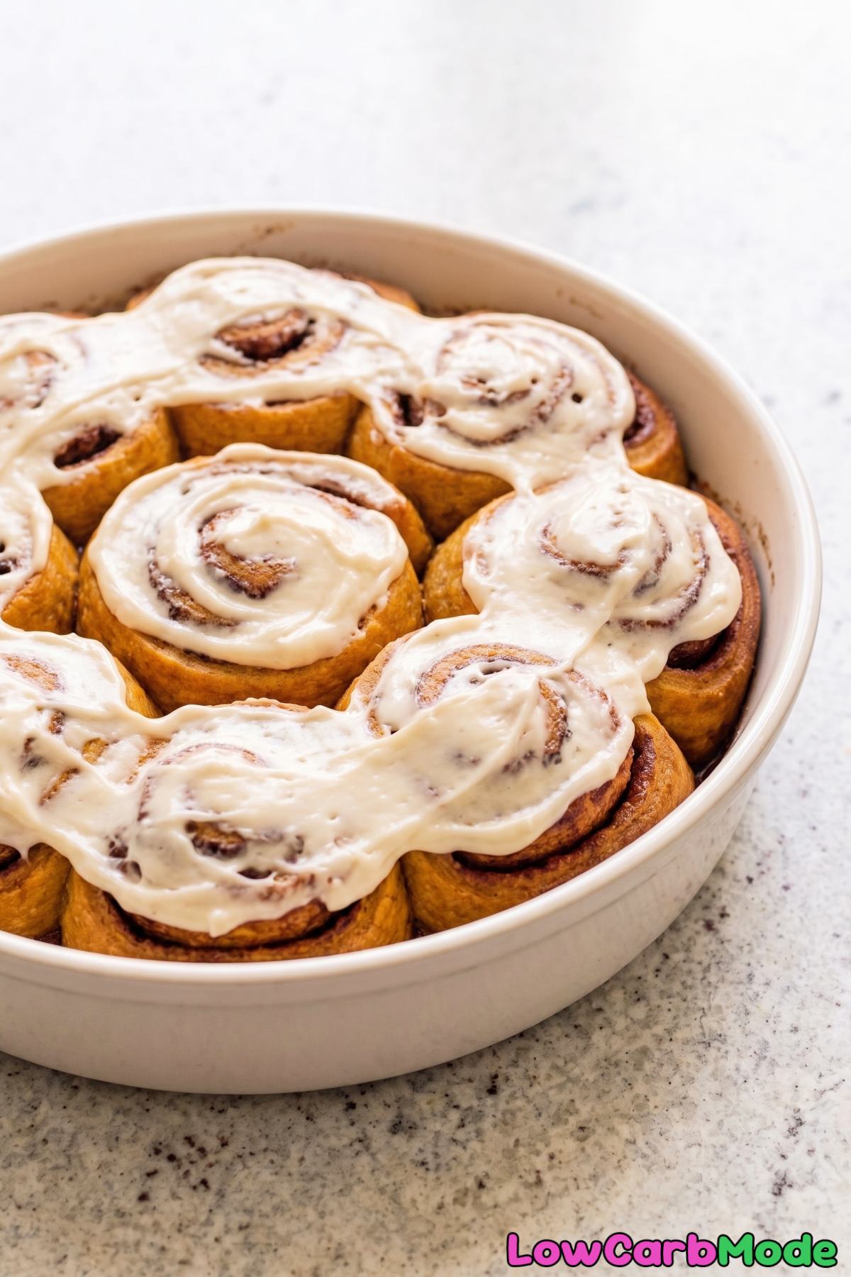frosted keto pumpkin rolls on a plate