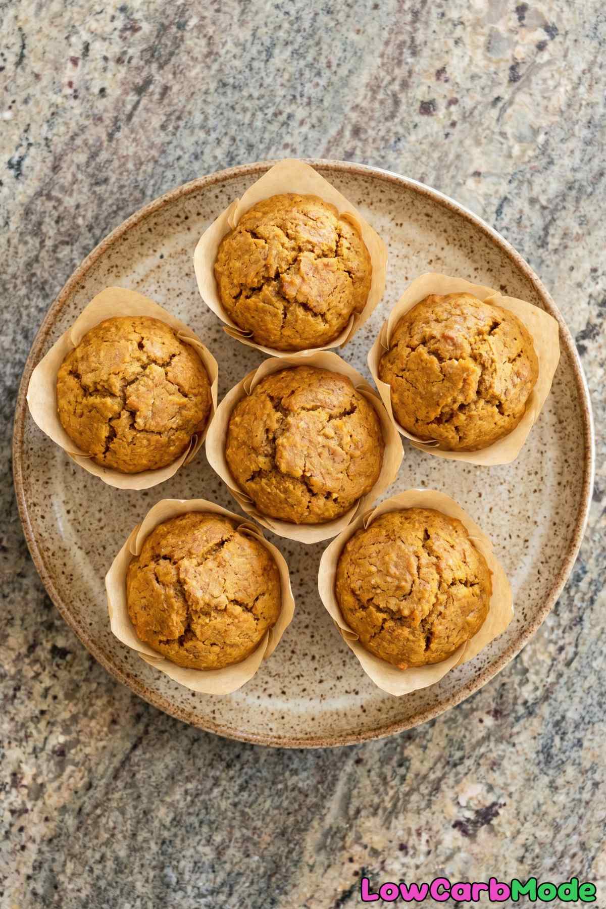 Spiced keto pumpkin muffins on a rack