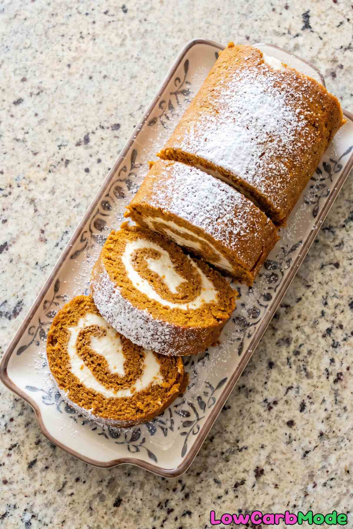 Decadent keto pumpkin roll with frosting