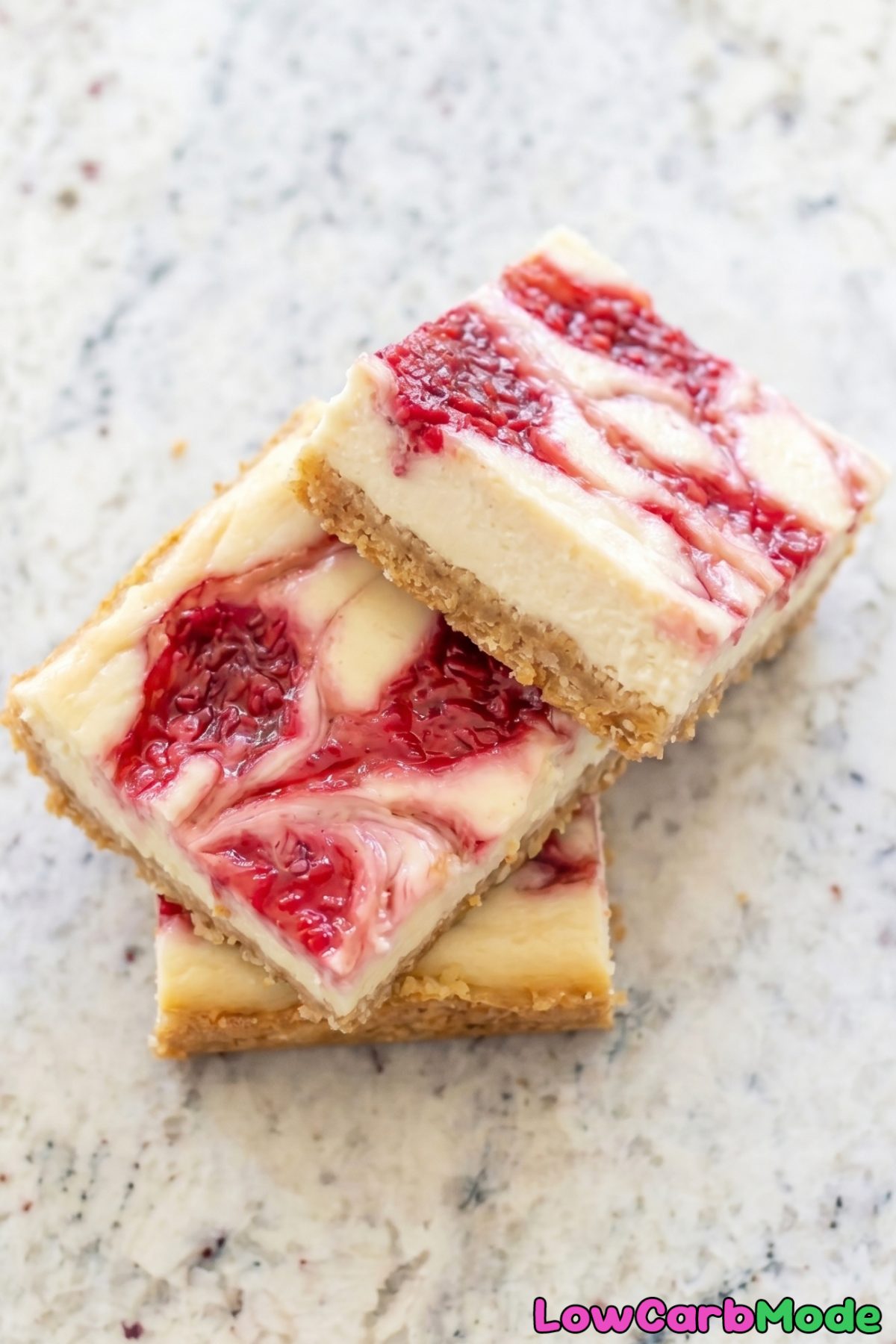 Rich keto raspberry cheesecake bars sliced
