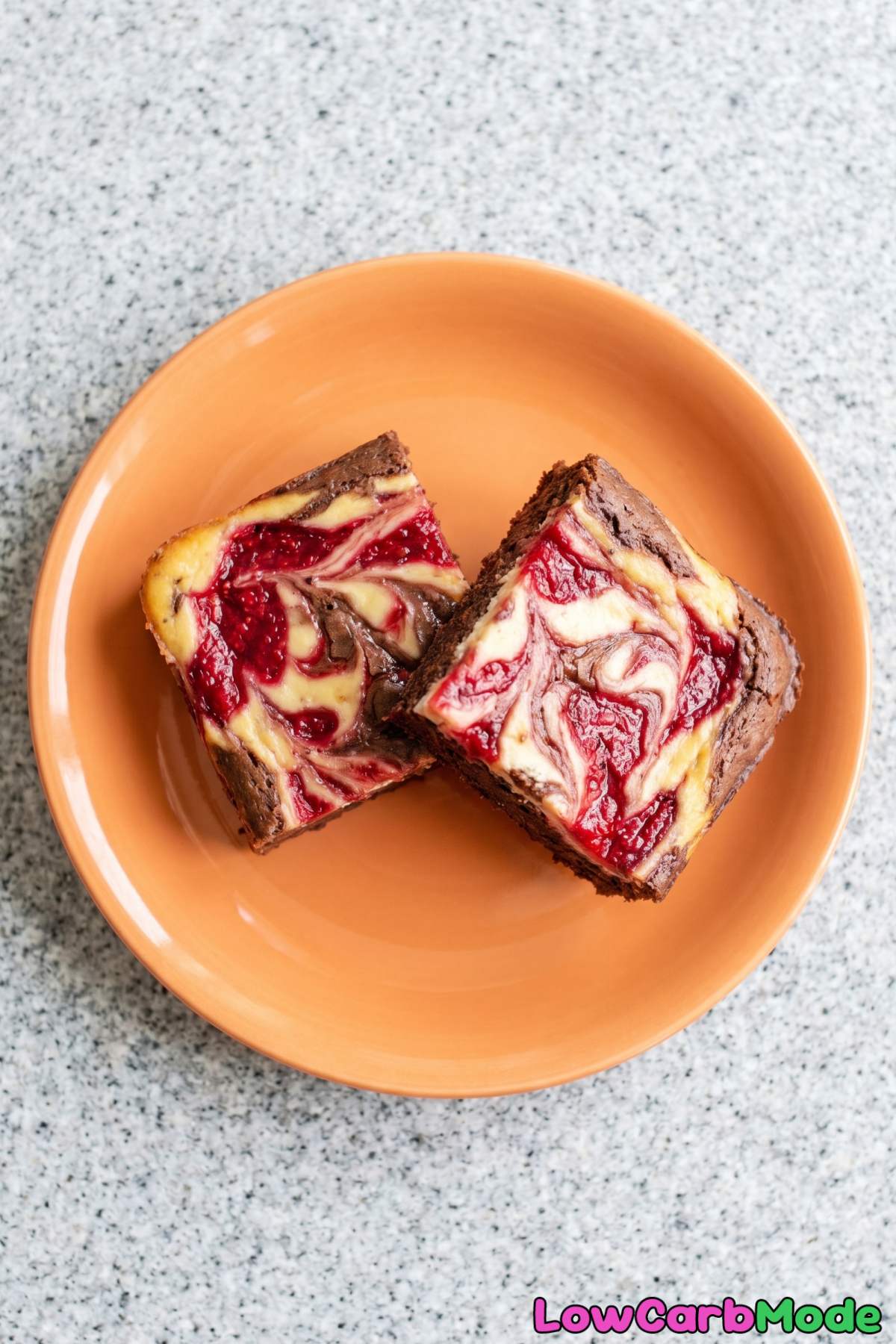 Velvety keto raspberry swirl cheesecake brownies