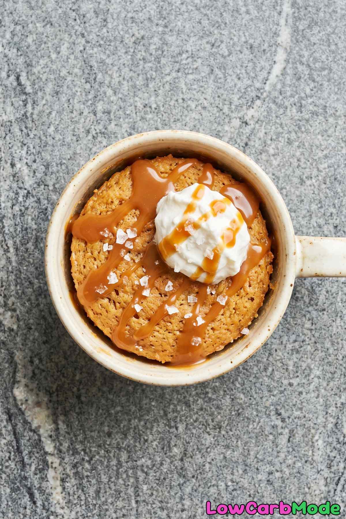 Warm keto salted caramel mug cake on table