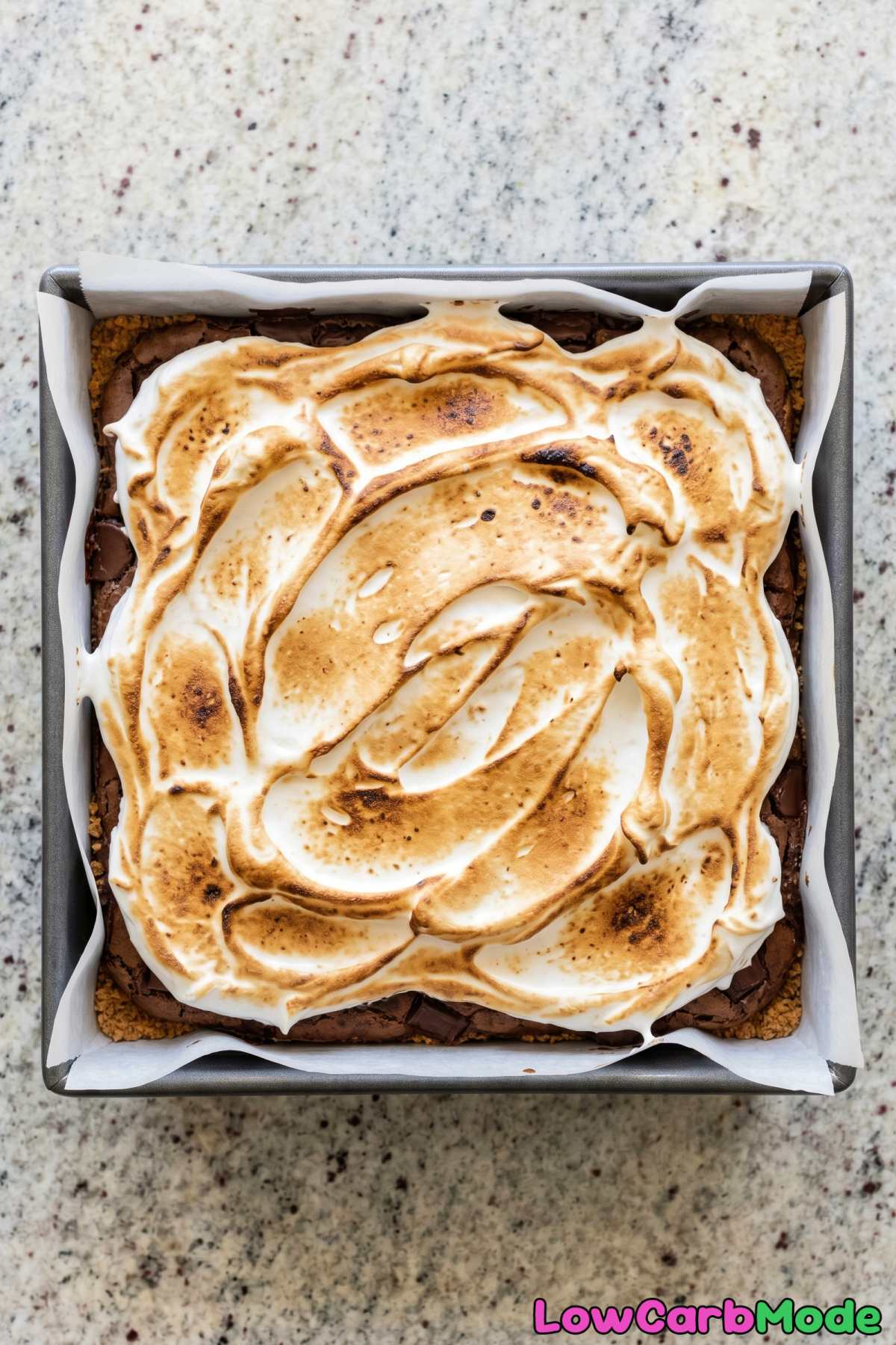 gooey keto brownies topped with meringue