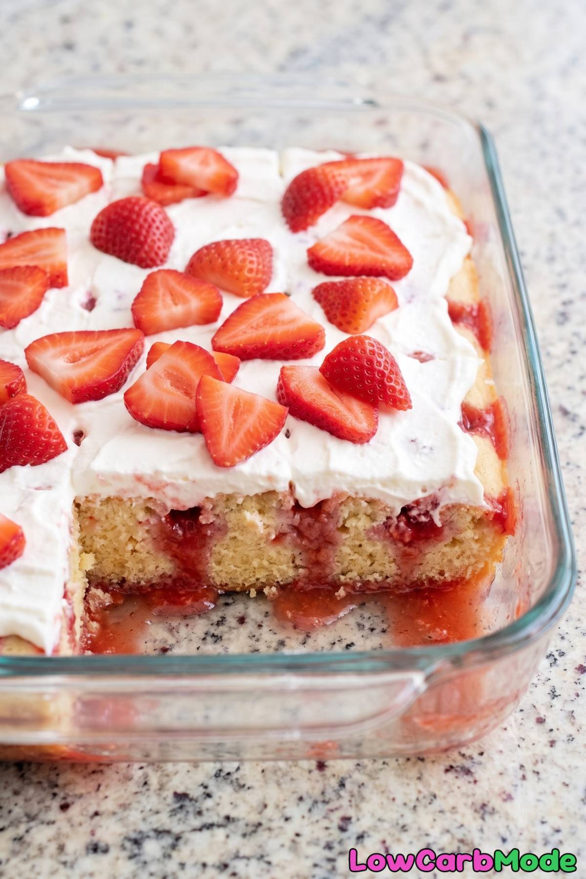 keto strawberries and cream poke cake slice